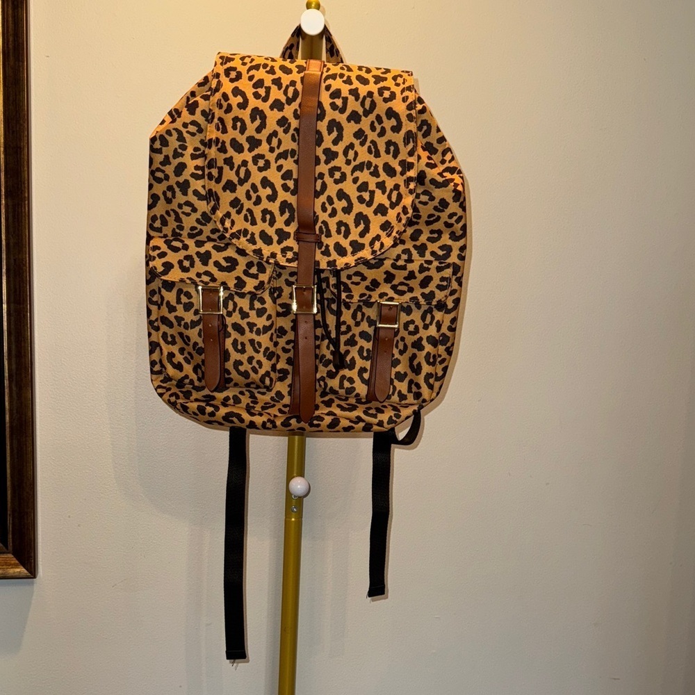 Leopard Print Backpack with faux leather straps and gold accents EUC  Accents